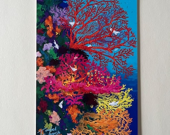 May include: A colorful illustration of coral reefs with various shades of red, pink, orange, and yellow. The coral is depicted in a swirling pattern, creating a sense of movement and depth. The background is a vibrant blue, representing the ocean.