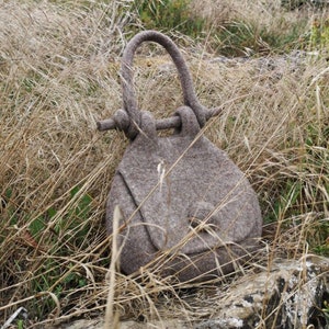 Bespoke design felted wool handbag. Sustainable design, unique hand felted bag in natural beige colour. Retro shape felt bag by Onstail. UK