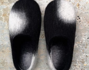 Felted wool cowhide slippers in natural black and white colours made in UK.