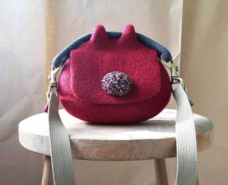 Red felted pouch cross body bag. Bespoke felted mini bag. Designer wool felt bag. Sustainable felt fashion. Handcrafted in UK image 1