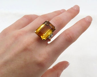 Circa 1940 Retro Era Ring; 22 carat Emerald Cut Natural Citrine Set In 14kt Gold