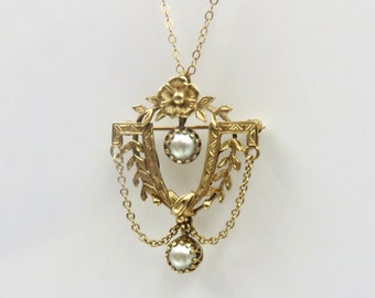 Circa 1900. 14kt Gold and Pearl Pendant Brooch