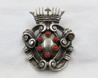 Circa Late 19th Century Silver and Coral Shield Crown Brooch