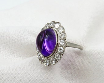 Circa 1920 Platinum Ring Set with Cabochon Amethyst and Old European Cut Diamonds