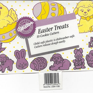 May include: A package of Wilton Easter Treats cookie cutters. The package features illustrations of Easter-themed shapes, including chicks, eggs, lambs, and bunnies. The text "Happy Easter" is also visible. The package includes 10 cookie cutters.
