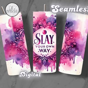 May include: A pink and purple watercolor design with a floral mandala and the text "SLAY YOUR OWN WAY" on a white tumbler.