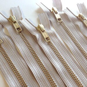 24 inch metal zippers, FIVE brass zippers, natural beige tape, YKK color 572, gold teeth YKK zippers image 5