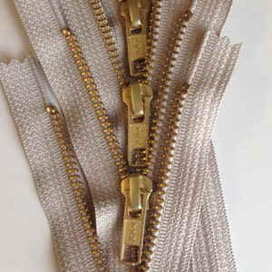 24 inch metal zippers, FIVE brass zippers, natural beige tape, YKK color 572, gold teeth YKK zippers image 4