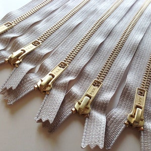 24 inch metal zippers, FIVE brass zippers, natural beige tape, YKK color 572, gold teeth YKK zippers image 3