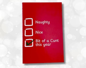 May include: A rectangular red card featuring a checklist with three white square boxes. The text next to the boxes reads Naughty, Nice, and Bit of a Cunt this year. A green checkmark is placed inside the third box next to the final phrase.