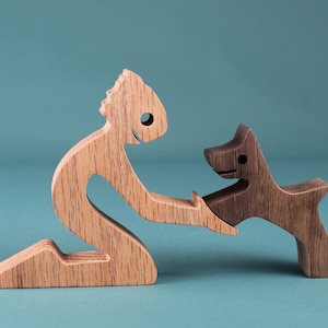 Handcrafted Wooden Man and Dog Sculpture: Minimalist Art Figurine for Pet Lovers and Home Decor