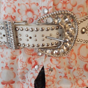 White faux leather belt Western style buckle. totally studded with some rhinestones/  34&quot;-39&quot;