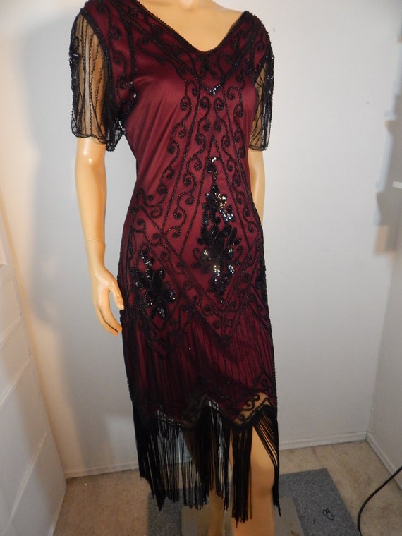 black sequin dress with fringe, red lining, great 