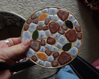 brown, white and green mosaic dish, gold back, three small feet,