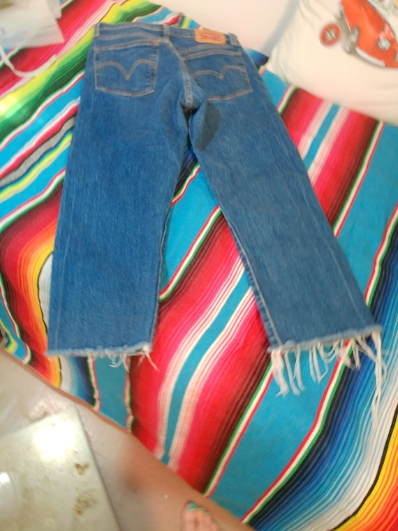 Levi 501 jeans, with stretch 25/32. actual waist 29, actual inseam 22".