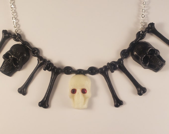 Creepy Crawlers Necklace Glow Skull with sparkle eyes and  Black Bones