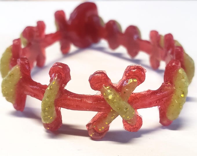 Gold Glitter Glam Monster Stitches on Red bracelet