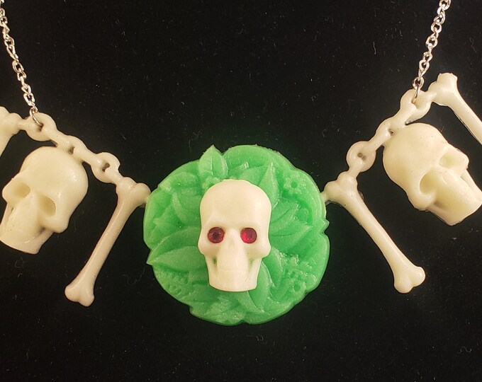 Creepy Crawlers Necklace Glow Skull and Bones with Red Sparkle eyes