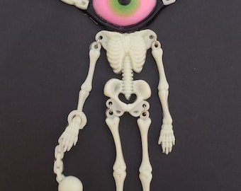 Creepy Crawlers Glow in the dark Skeleton Necklace with Eyeball Head