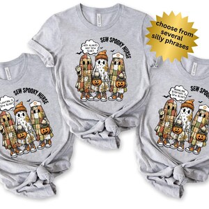 May include: Three light gray t-shirts with a Halloween-themed graphic. The graphic features cartoon ghosts in patchwork outfits, holding jack-o'-lanterns. Text includes "SEW SPOOKY NURSE" and phrases like "Floating is Sew Scary".