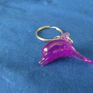 Two Dozen Assorted Plastic Dolphin Charms: Craft Supply