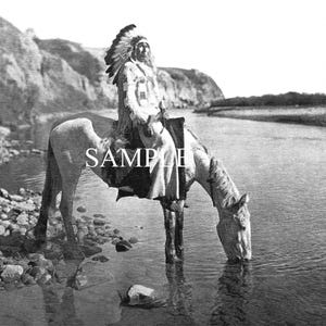 May include: Black and white photograph of a Native American man on horseback drinking from a river. The man wears a feathered headdress and traditional clothing. The horse is light-colored, and the scene is set in a natural landscape.