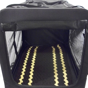 May include: Black soft-sided pet carrier with a zippered top and a mesh window. The carrier has a black and tan patterned bed inside.
