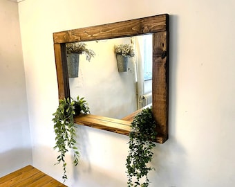 Rustic Teak Waxed Mirror with a feature shelf, Come's ready to hang and will suit any room.