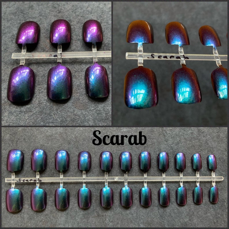 Short purple to green false nails shown on a black background. Top two photos show close up view. Text reads scarab. bottom picture shows full set of 24 press on nails.