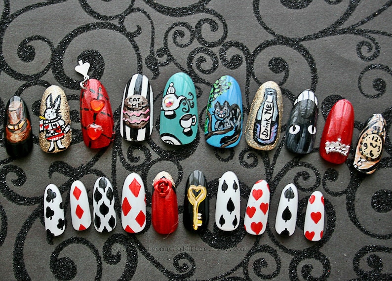 Twenty hand-painted press on nails depicting items from Alice In Wonderland, including Tea, Rabbit, a Top Hat, Cheshire Cat, "Drink Me" bottle, "Eat Me" cake, clock, and playing card designs