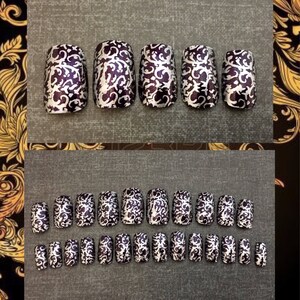 5 purple coffin shaped nails with silver detailing on black background. bottom photo  shows a full set of 20 purple coffin shaped nails with silver detailing on black background.