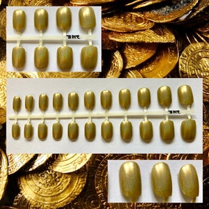 Metallic press on nails with different shapes and a close up shot of the nails to show the shimmer in the gold glitter.