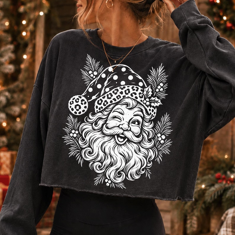 Vintage Leopard Print Santa PNG design on a dark background, showcasing Santa's face with a leopard print hat and festive greenery.