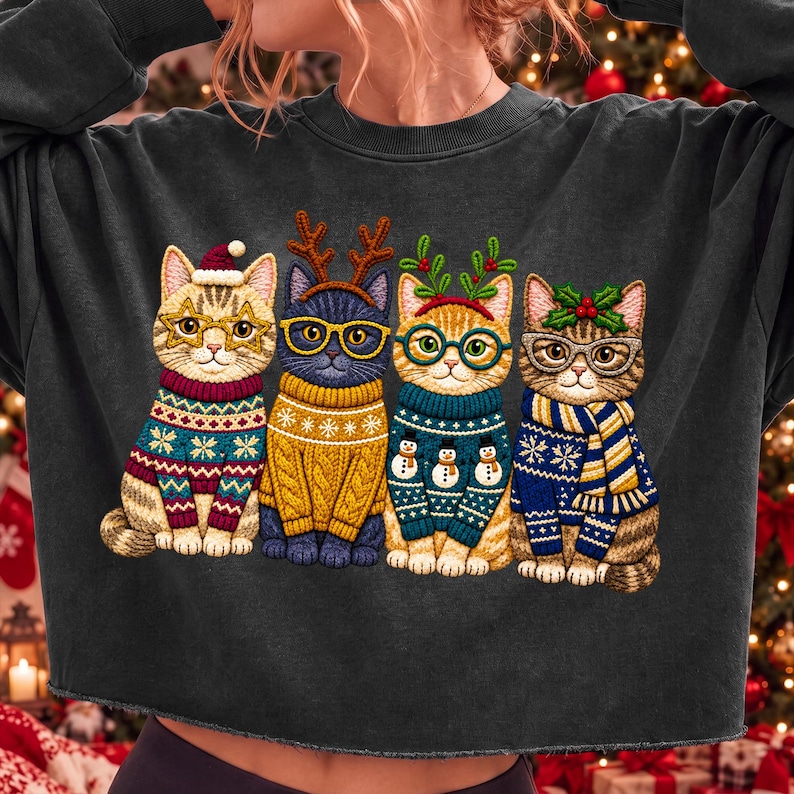 Adorable lineup of four Christmas cats wearing festive sweaters and winter accessories