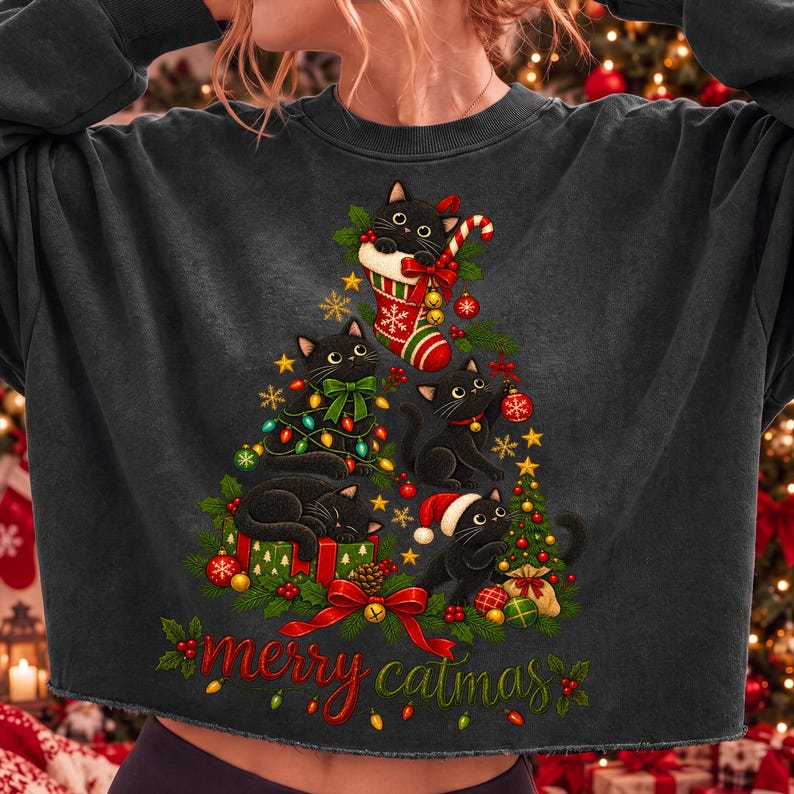 Merry Catmas Black Cat Christmas PNG design displayed on a black t-shirt mockup