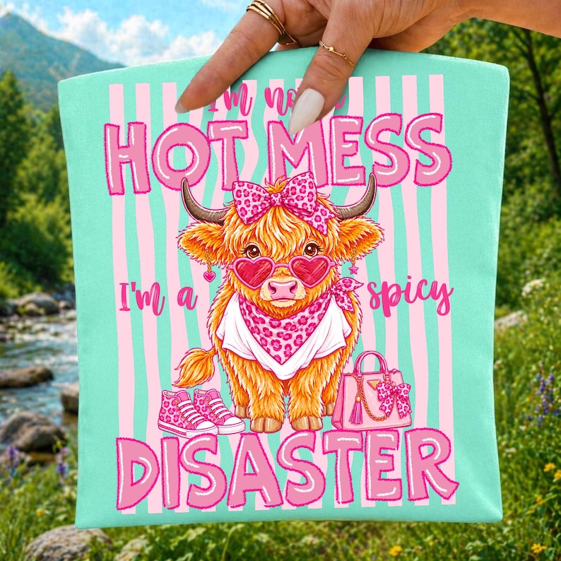 Spicy Disaster Highland Cow PNG Sublimation Design on a T-Shirt