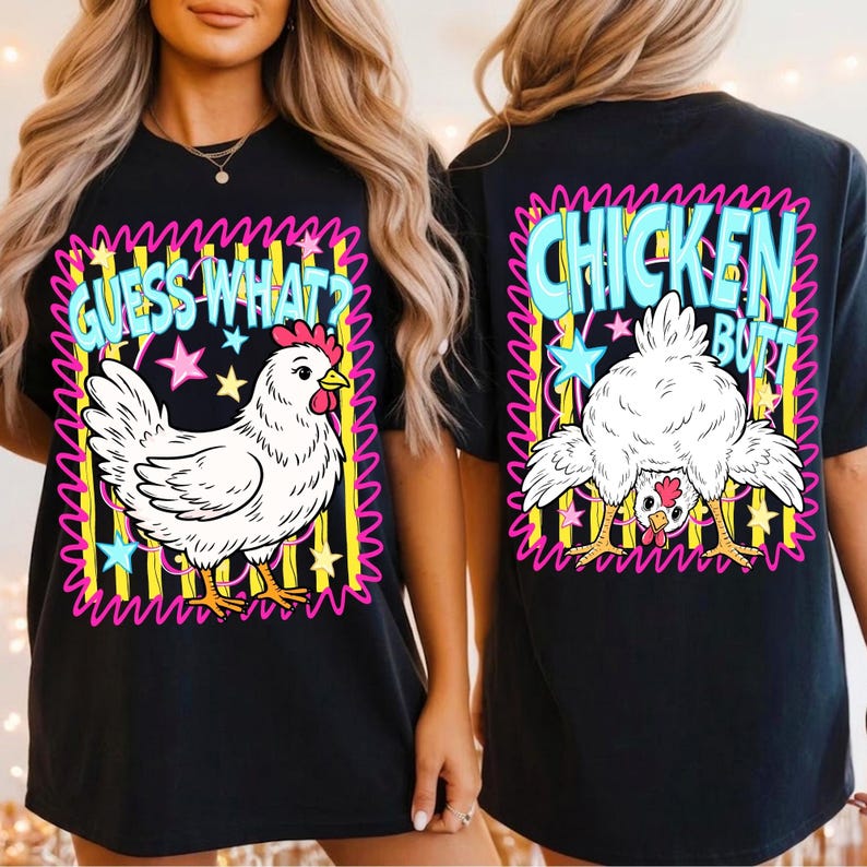 May include: Black t-shirt with a whimsical chicken graphic. The front features a white chicken with the text "GUESS WHAT?" and stars. The back displays a chicken's rear with the words "CHICKEN BUTT".