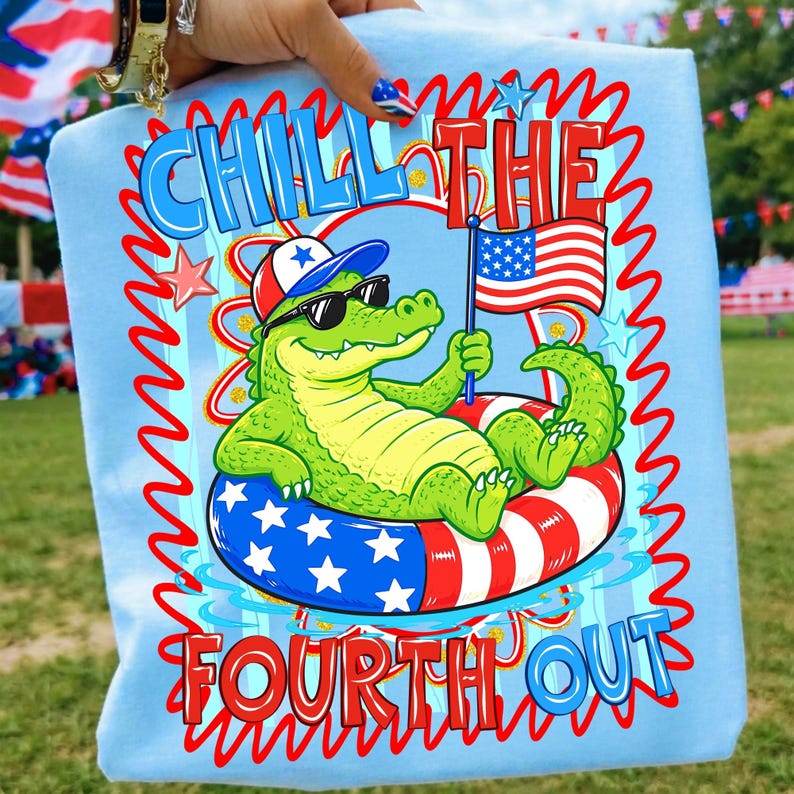 Close-up of 'Chill the Fourth Out' gator design on a t-shirt, showcasing red, white, and blue colors.