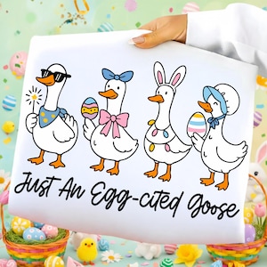May include: White fabric featuring four cartoon geese, each adorned with Easter-themed accessories. One goose wears sunglasses and holds a sparkler, while others have bows, bunny ears, and Easter eggs. The text "Just An Egg-cited Goose" is below.