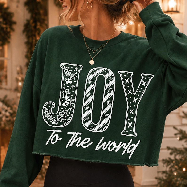 Close-up of 'JOY To The World' Christian Christmas digital design with holly and candy cane stripes