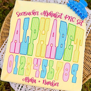 May include: A pale yellow background features a colourful alphabet and number set. The text reads "Seersucker Alphabet PNG Set" and "Alpha + Number". The letters and numbers are striped in pink, green, yellow, and blue.