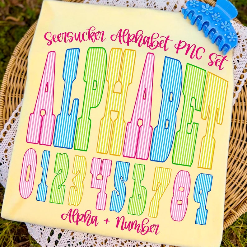 May include: A pale yellow background features a colourful alphabet and number set. The text reads "Seersucker Alphabet PNG Set" and "Alpha + Number". The letters and numbers are striped in pink, green, yellow, and blue.