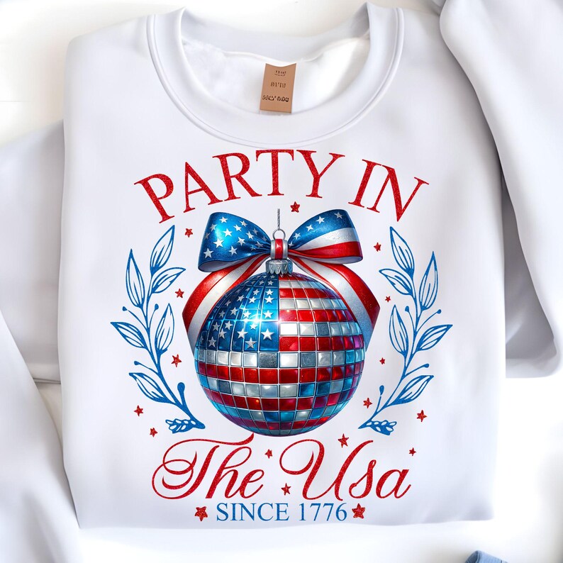 Mockup of a T-shirt displaying the 'Party in the USA' Coquette 4th of July disco ball design, perfect for festive apparel.