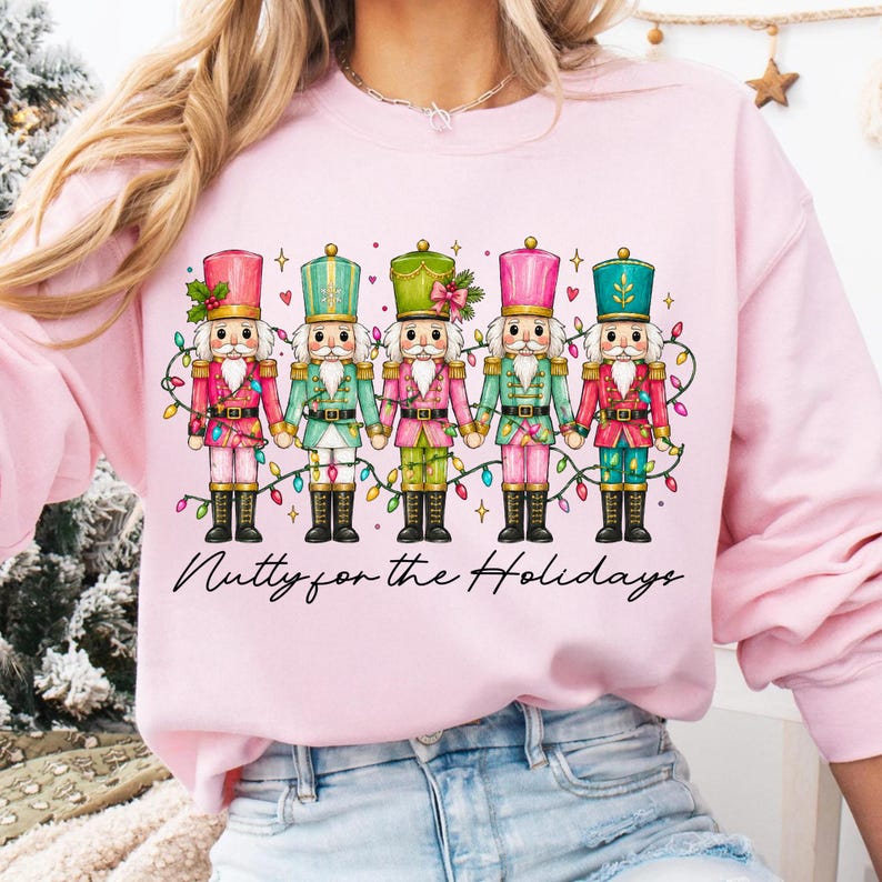 Preppy Nutcracker Sublimation Design on a White Sweatshirt Mockup