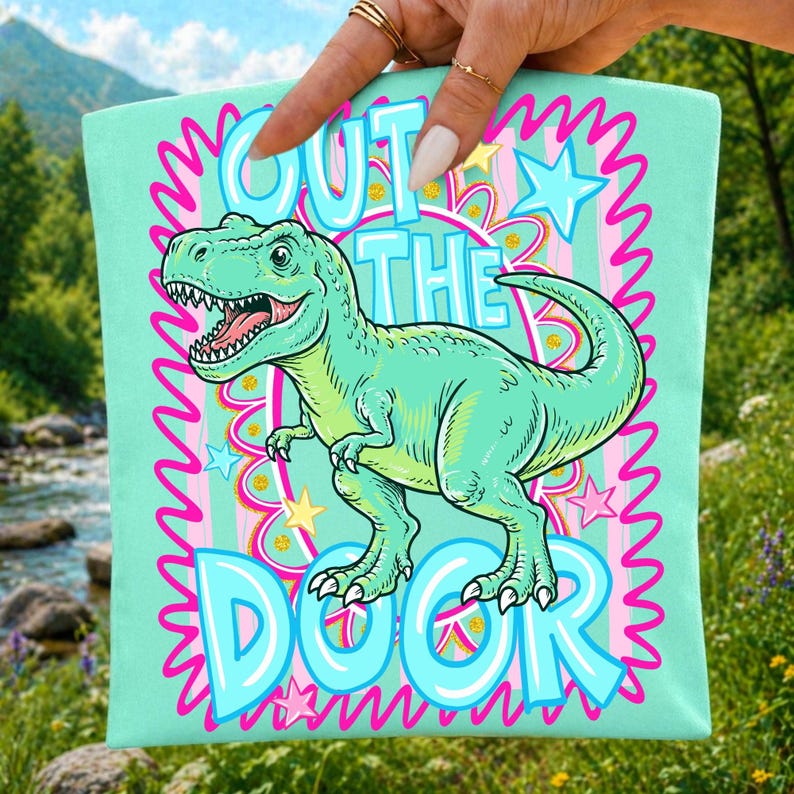Close-up of the 'Out The Door Dinosaur' digital design showcasing the bright neon colors and retro preppy typography.