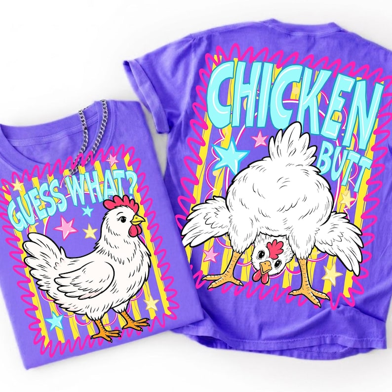 May include: Two purple t-shirts with chicken-themed graphics. One shirt says "Guess What?" with a cartoon chicken. The other says "Chicken Butt" with a chicken bending over. Both shirts have colorful star and line accents.
