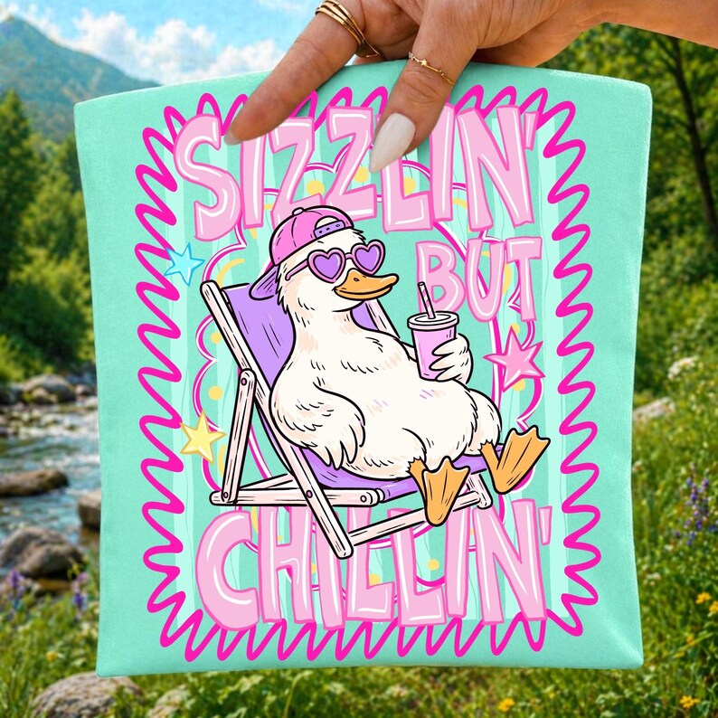 Mockup showing the Sizzlin But Chillin' Duck sublimation design applied to a t-shirt, perfect for summer apparel.