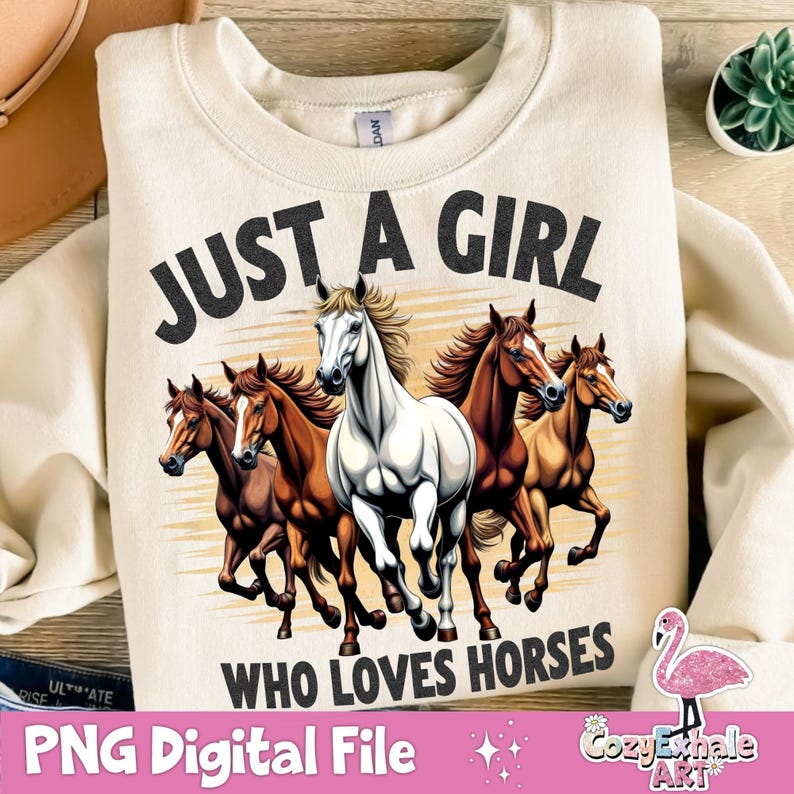 May include: A beige sweatshirt with the text "Just a girl who loves horses" in black. The design features four horses running in a field.