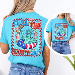 May include: A light blue t-shirt with a graphic of the Statue of Liberty wearing sunglasses and floating in a red, white, and blue inner tube. The text "Chill the Fourth Out" is displayed in a wavy font.