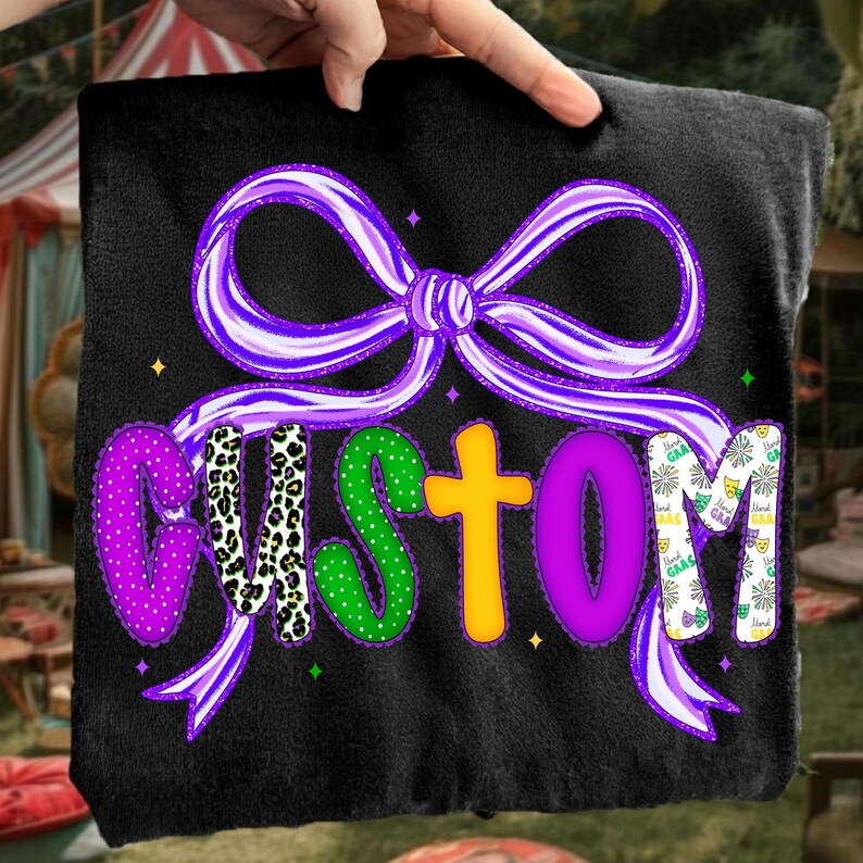 May include: Black fabric with a purple bow and the word "CUSTOM" in various colors and patterns. The letters are purple polka dots, leopard print, green polka dots, yellow, purple, and a white and purple pattern.